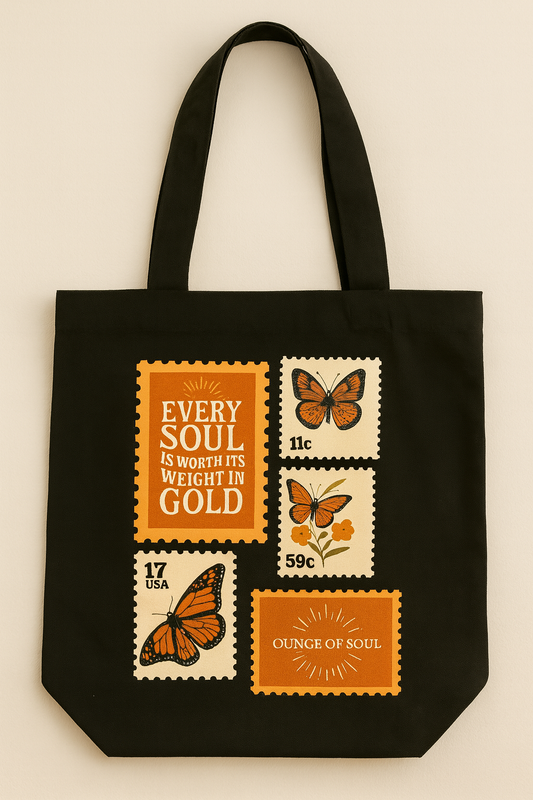 Black tote bag with vintage-style postage stamp designs featuring butterflies and text.