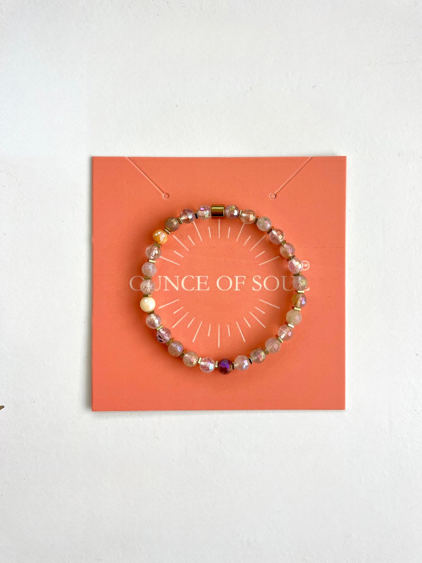 Pebble stone beaded bracelet on a 'ounce of Soul' branded card with a white background