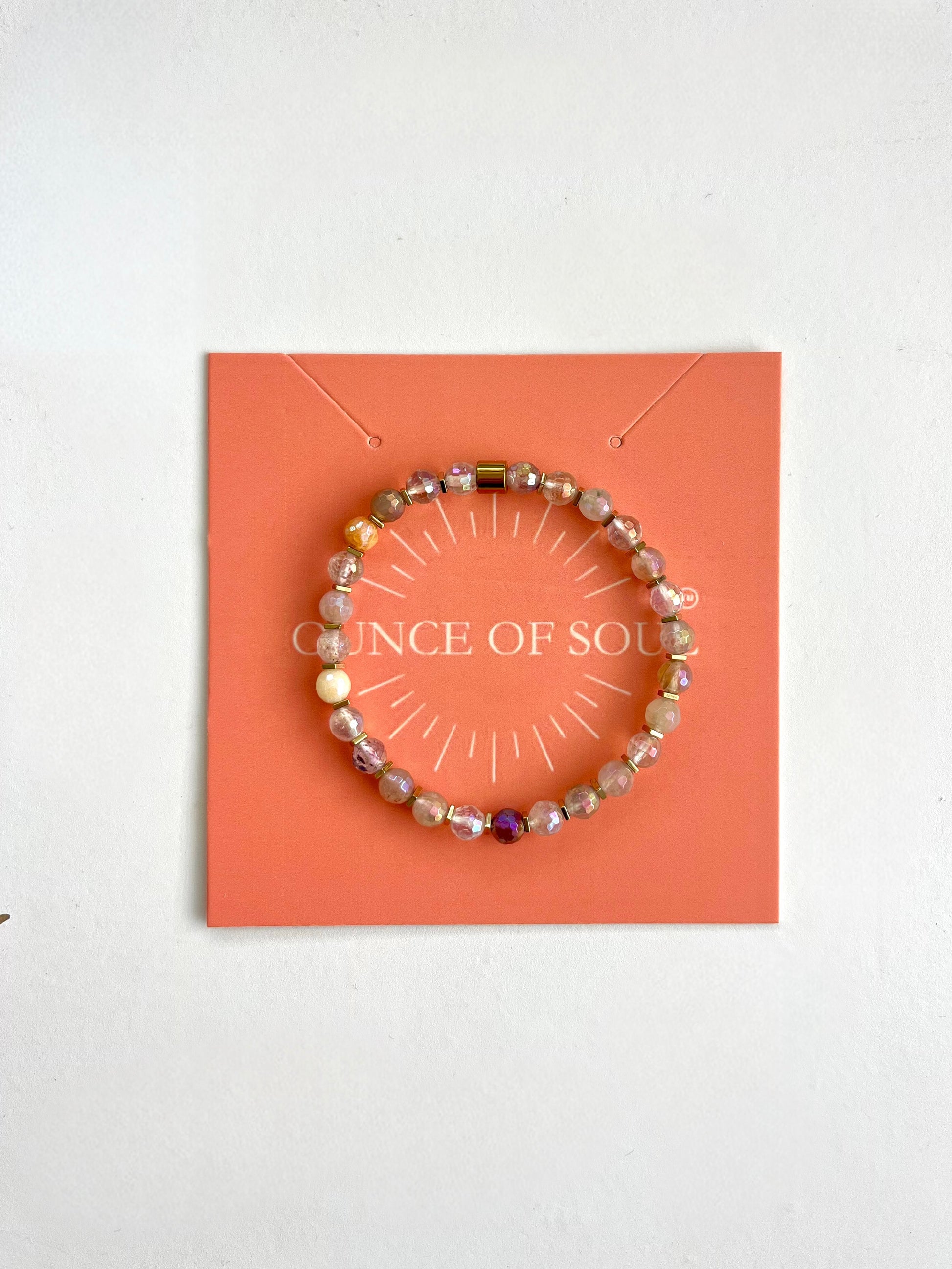 Pebble stone beaded bracelet on a 'ounce of Soul' branded card with a white background