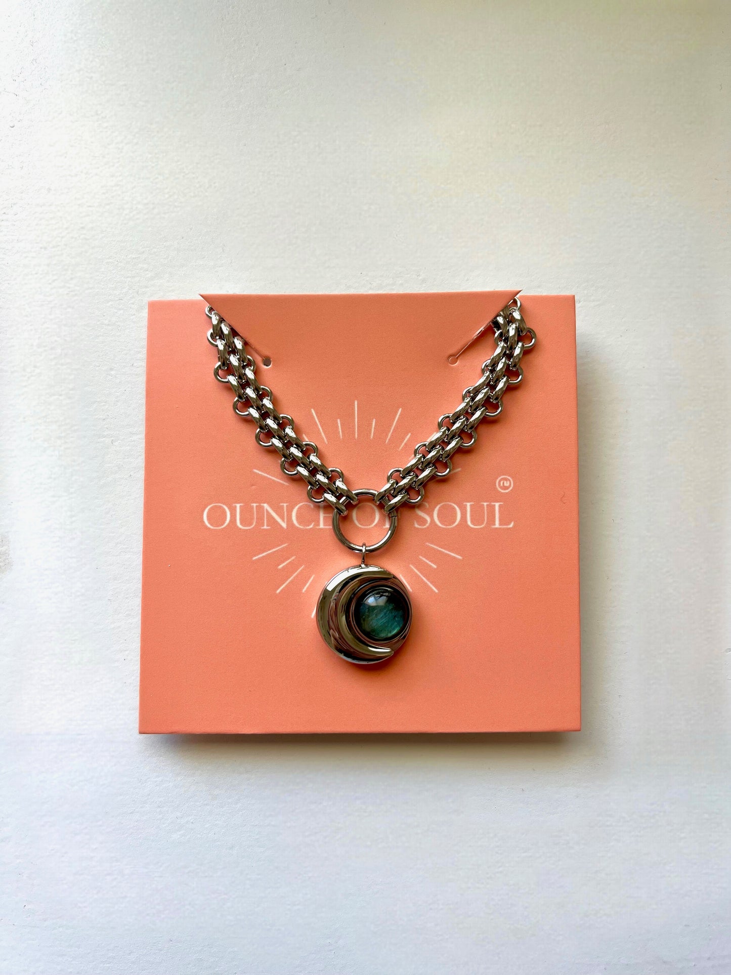 moon cresent Necklace with a pendant on an 'Ounce of Soul' branded card against a white background